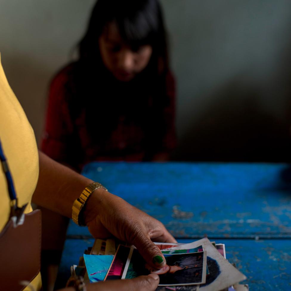 A suspected trafficking victim is held at a checkpoint on the way out of the Kathmandu valley