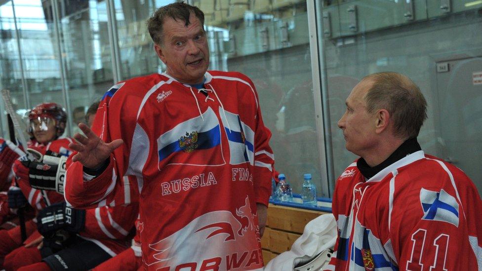 Russia's President Vladimir Putin (R) and Finland's President Sauli Niinisto (C) speak as they take part in a friendly ice hockey match in Igora resort near in St. Petersburg, on June 22, 2012.