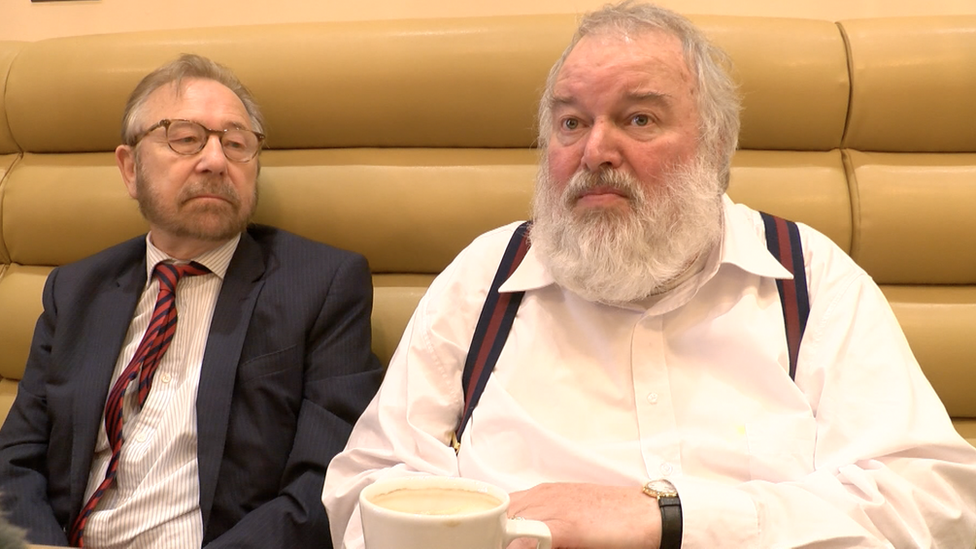 Two men working in a coffee shop