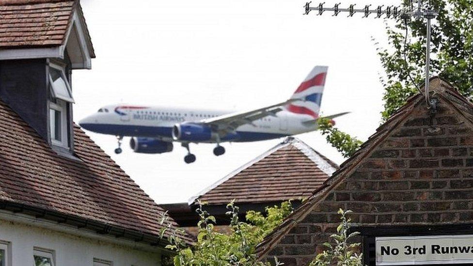 A British Airways plane approaches Heathrow