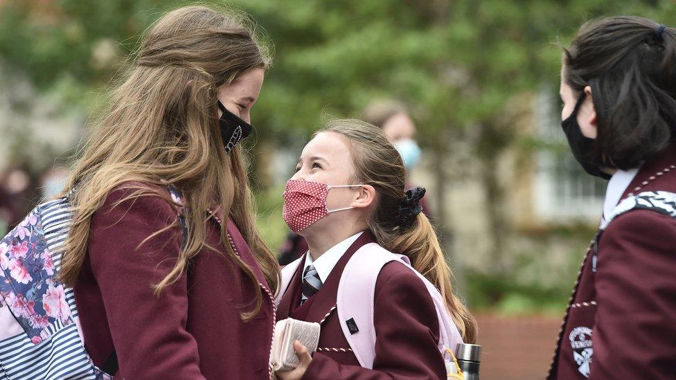 Pupils wearing masks in playground