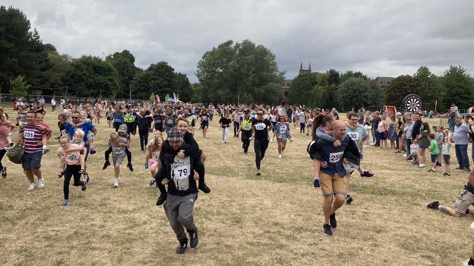 Residents taking part in the piggyback challenge