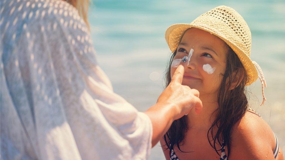 sunscreen-on-young-girl's-face.