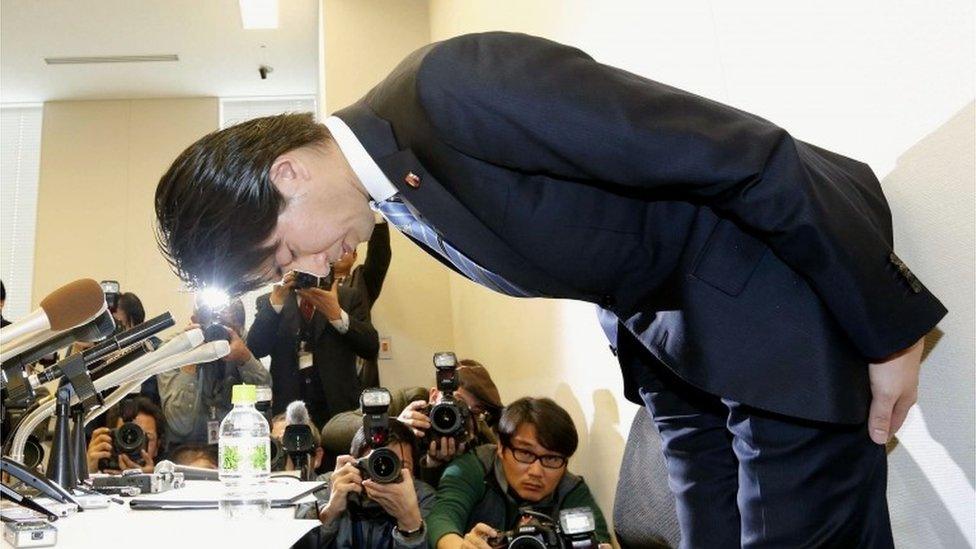 Kensuke Miyazaki bows at his press conference in Tokyo (12 Feb 2016)