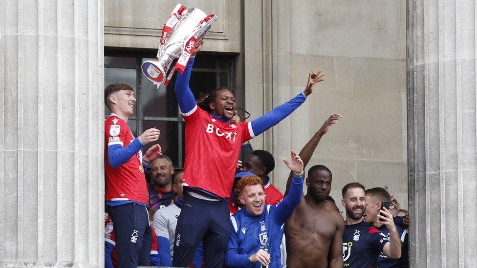 Players lift trophy