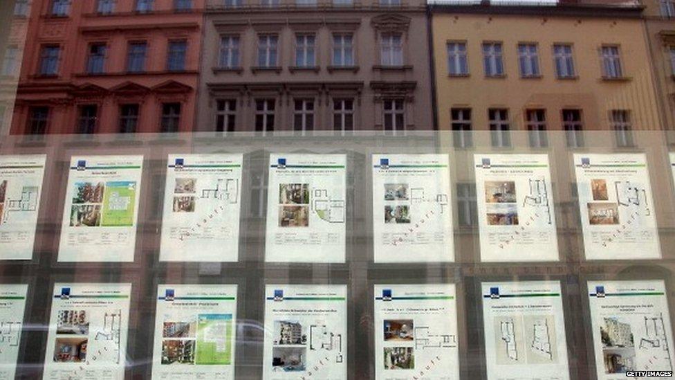 New residential apartments are advertised for sale, with some showing as "verkauft", or sold, in a real estate agents window in the Mitte district of Berlin, Germany (April 2013)