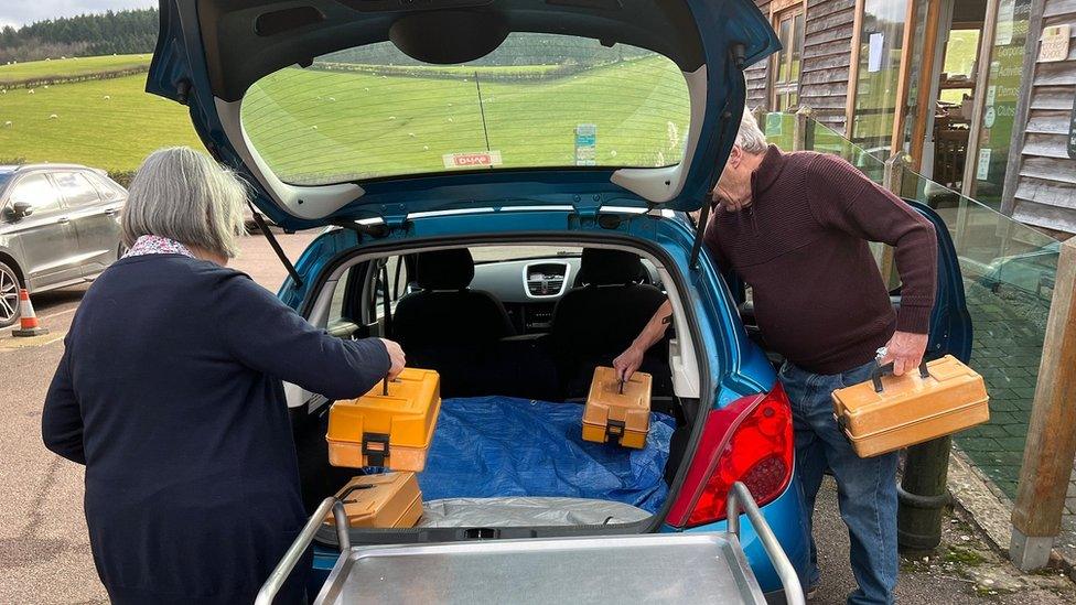 Food deliveries loaded into car