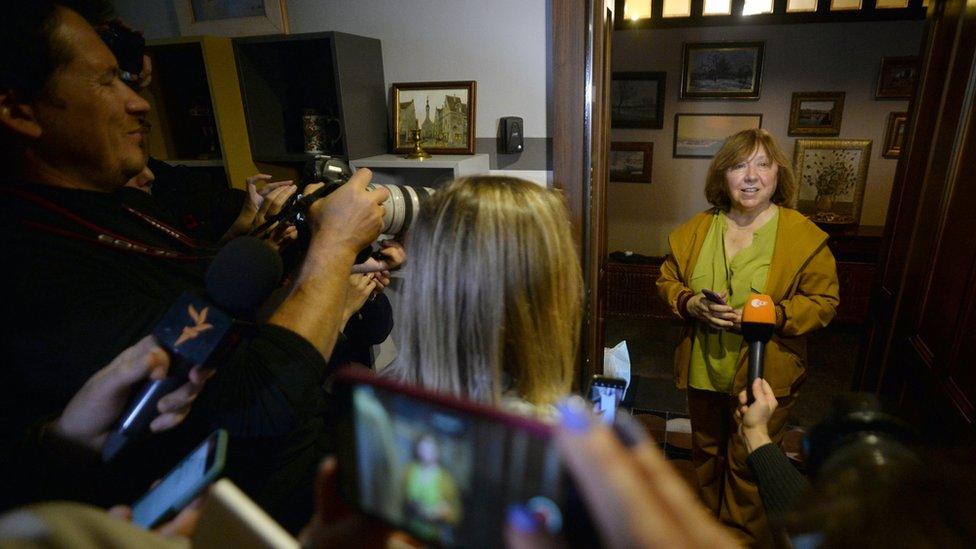 Svetlana Alexievich called supporters to her home, saying masked men had tried to enter it