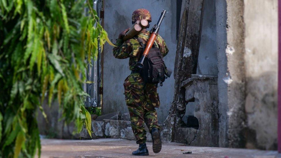 A soldier carries a rocket propelled grenade launcher in Freetown, Sierra Leone, 27 November 2023.