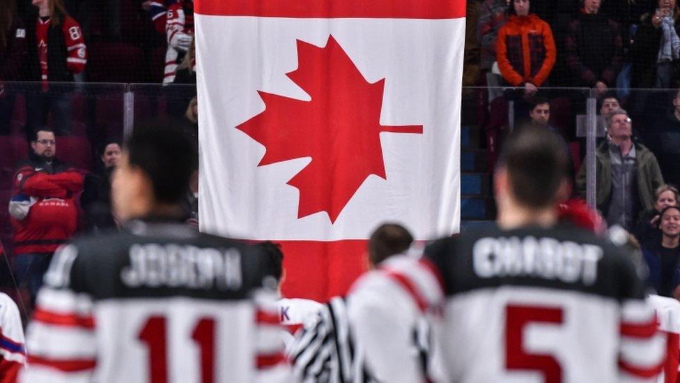 Canada flag and ice hockey team