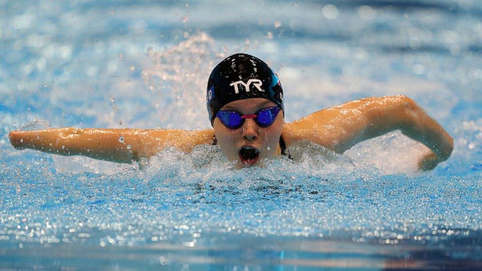 toni swimming in an indoor pool