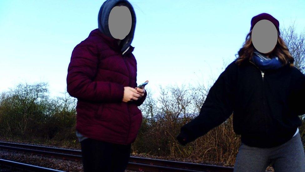 Girls on railway track