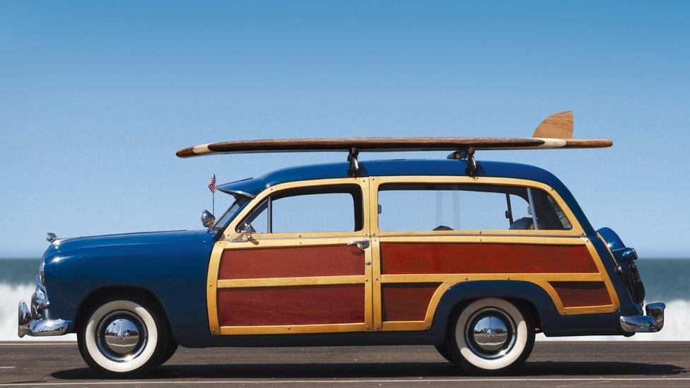 Old-fashioned car with wood doors and side panels