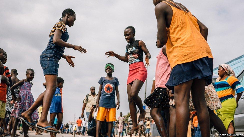 Girls from the James Town community take over part of the street at The Chale Wote Street Art Festival to play Ampe, a traditionally Ghanaian game, mainly played by girls.