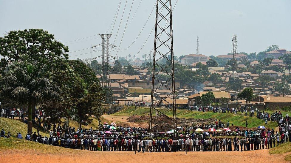 People line up to cast their vote in presidential and parliamentary polls in Mukono District