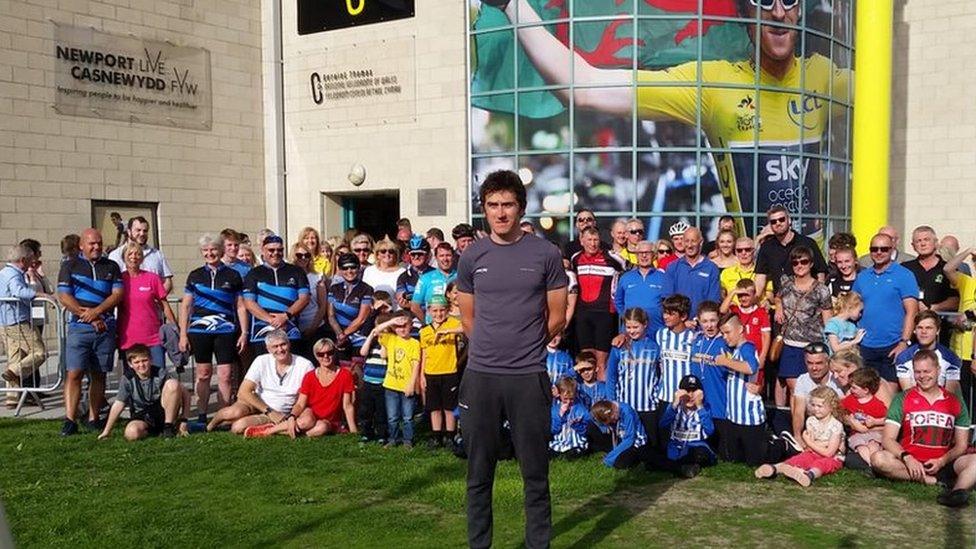 Geraint standing in front of children at the velodrome