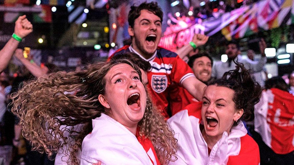 Fans at BOXPARK in Croydon celebrate England reaching the final after watching the Euro 2020 semi final match between England and Denmark.