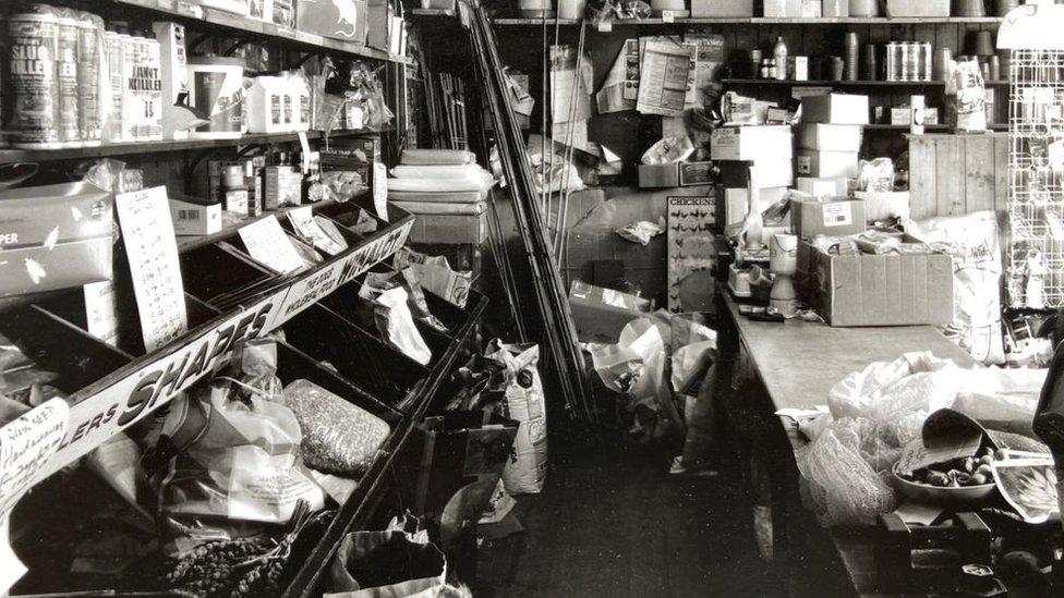 old black and white photo of inside the shop