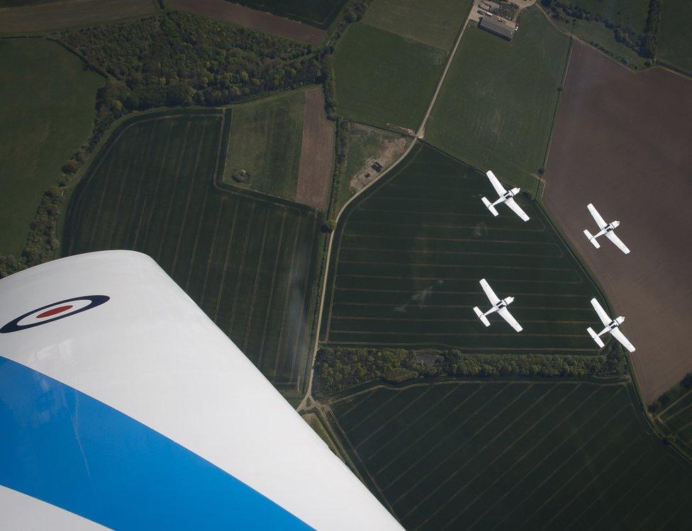 Four Tutors in formation over rural Cambridgeshire