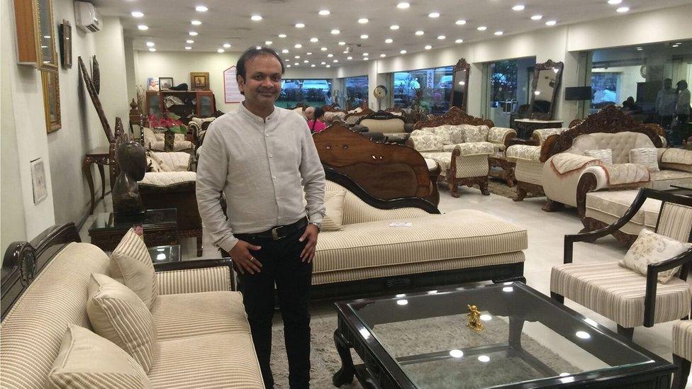 Traditional furniture shop owner Deepak Agarwal photographed in his shop