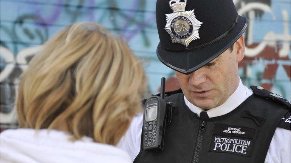 Police officer speaking to a person