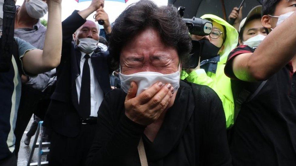 A mourner at the funeral on Monday