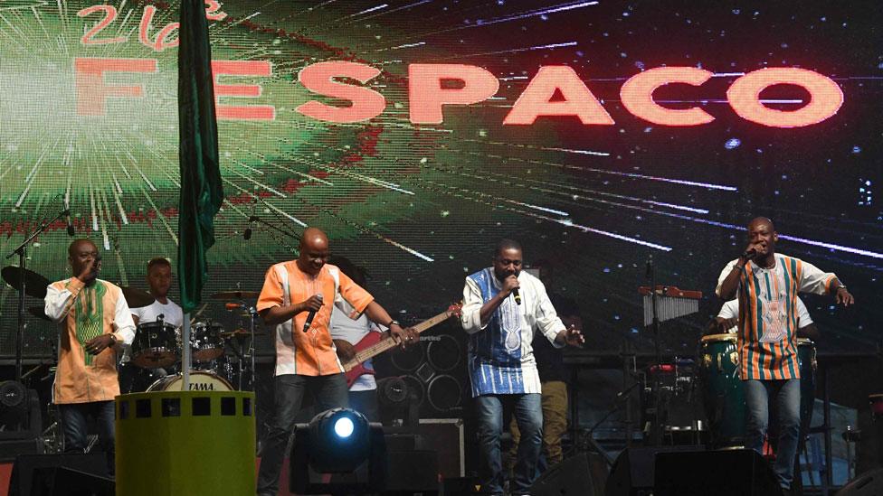 Ivory Coast's music band Magic System performs on stage during the opening ceremony of the FESPACO Panafrican Film and Television Festival of Ouagadougou, in Burkina Faso, on February 23, 2019