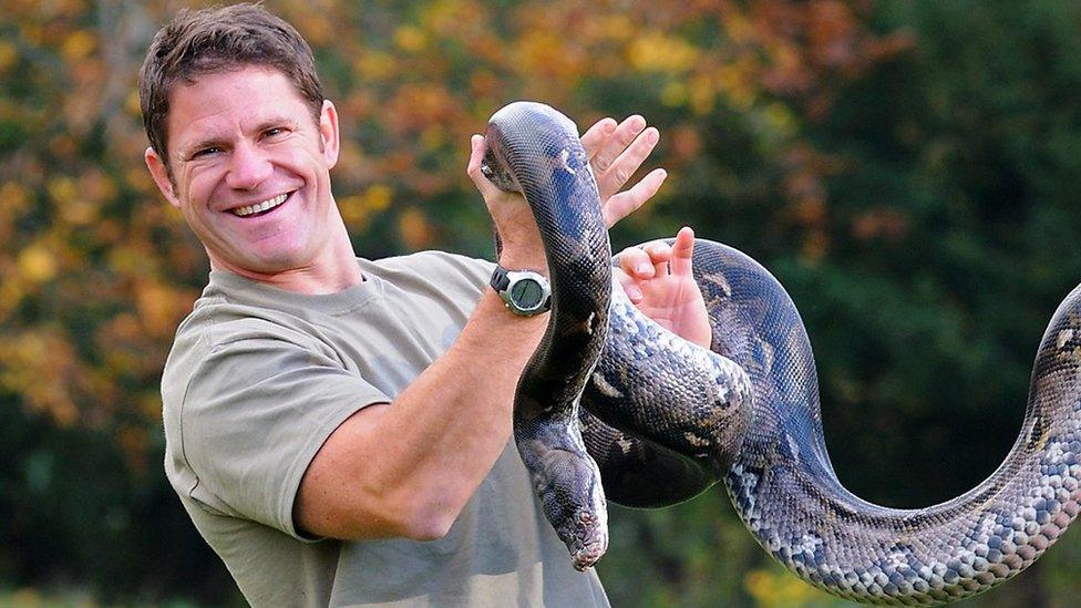 Steve Backshall with a snake