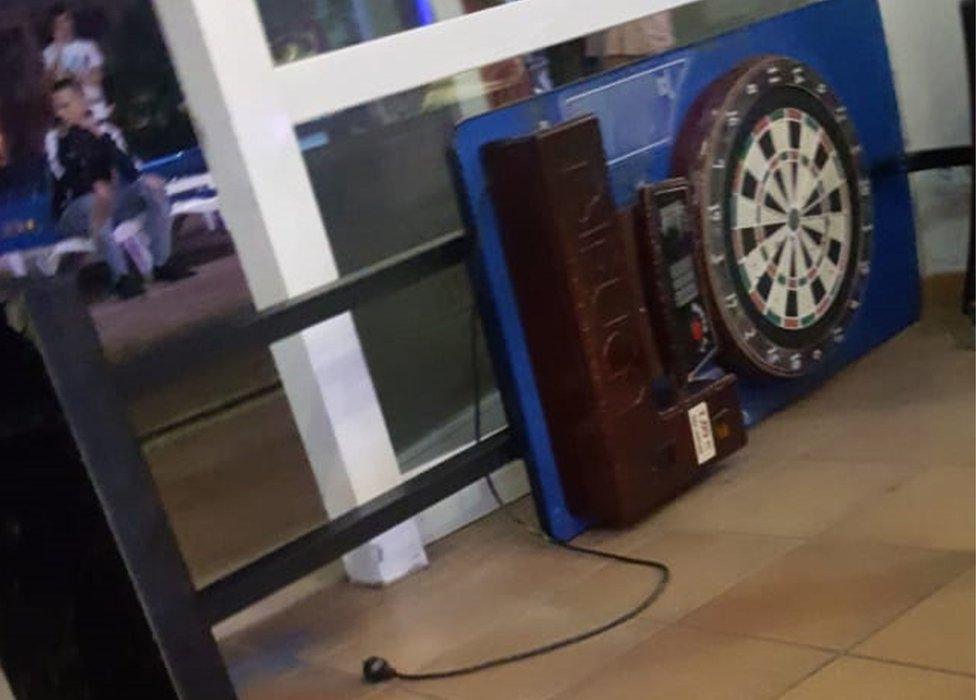 The arcade darts machine which fell on him