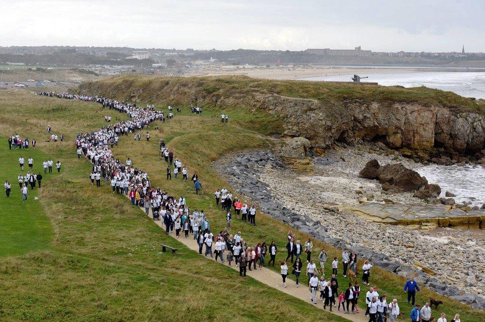 Thousands of walkers make their way along the coastal route