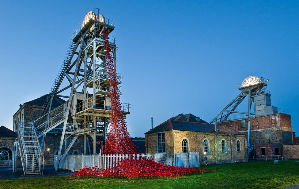 The Weeping Window ceramic poppies cascading from a pit wheel at Woodhorn Museum