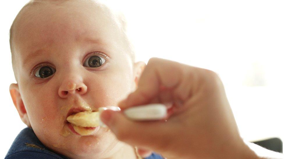 Baby being fed