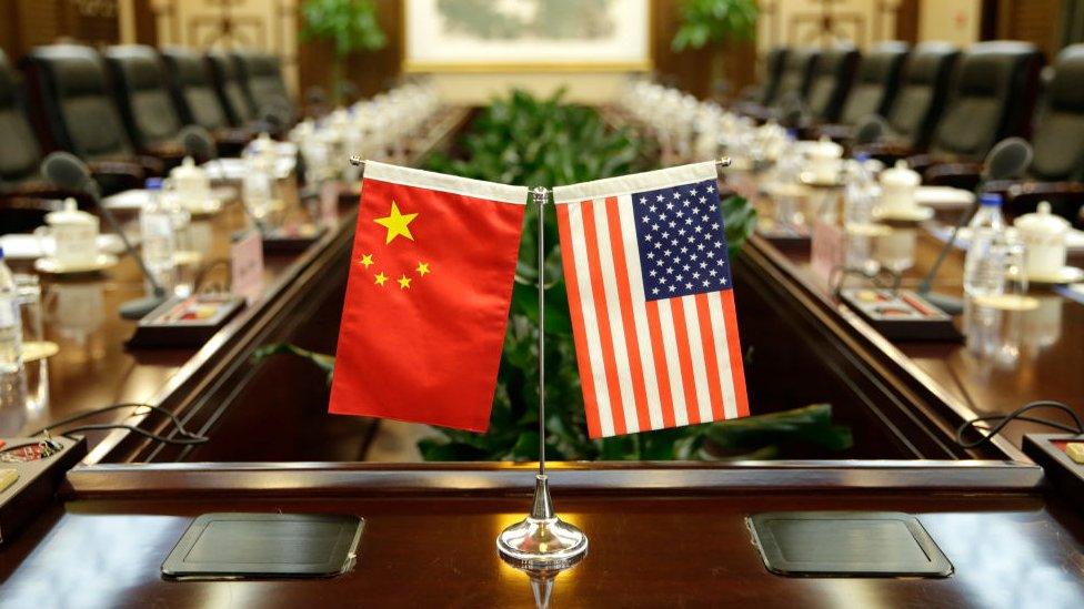 Flags of the US and China are placed ahead of a meeting