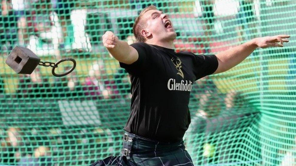 A competitor throwing a weight