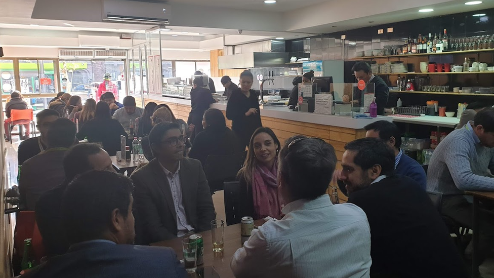 Customers at Andres Cohen's cafe in Santiago, Chile