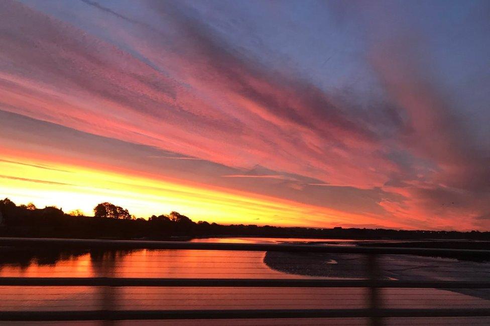 Colourful skies over a river