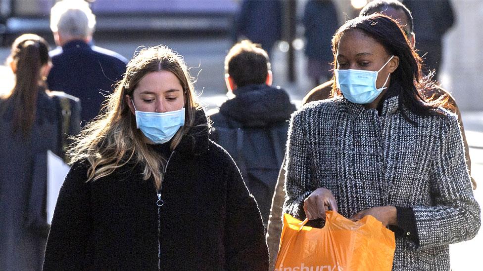 Women wearing masks in the street