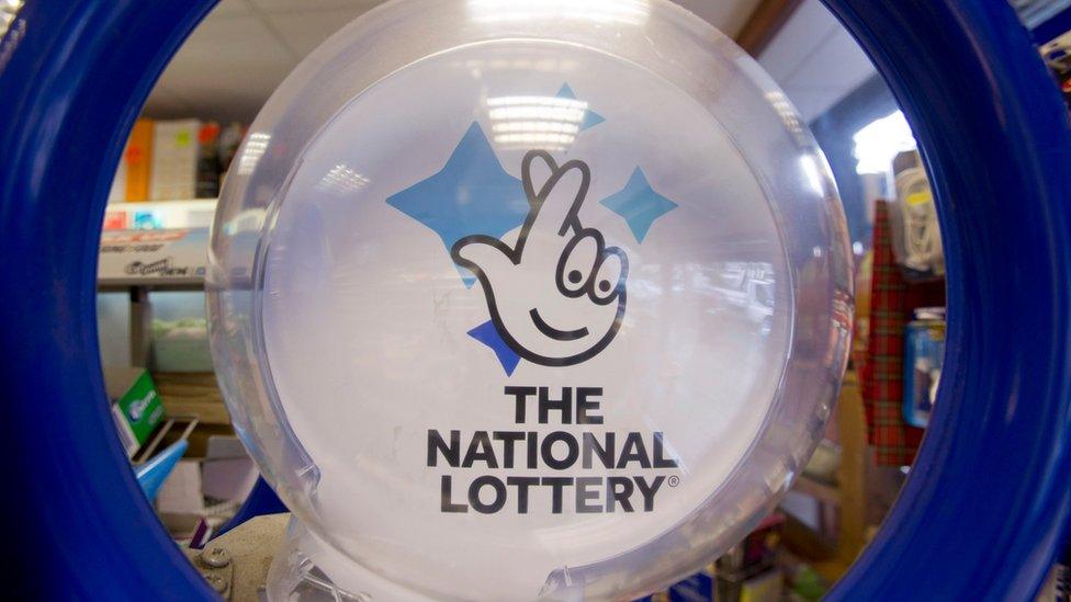 File photo of a national lottery ticket stand logo.