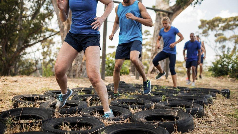 People doing an obstacle course