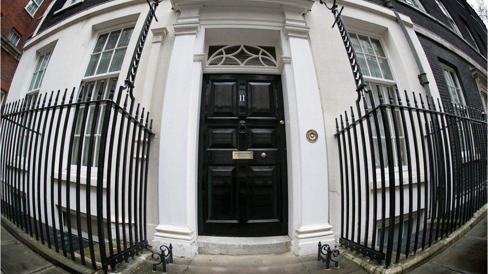 The front door of Number Eleven Downing Street is pictured in central London, on March 11, 2008