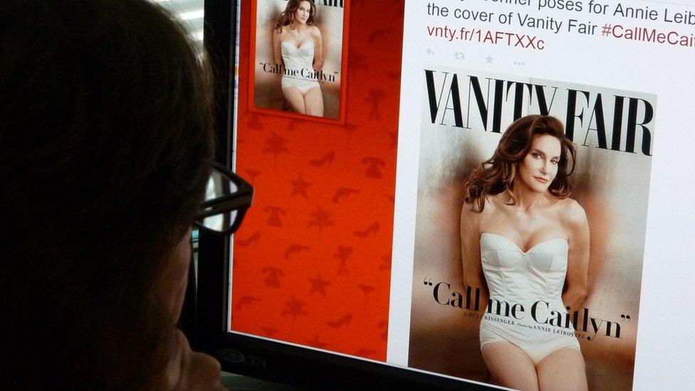 Man looks at picture of Caitlyn Jenner on Vanity Fair website