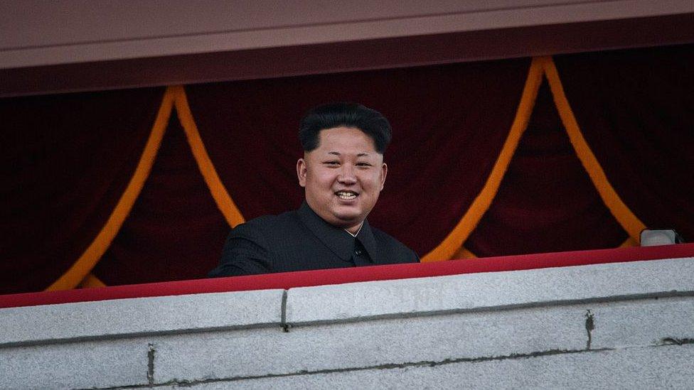 North Korea's leader Kim Jong-Un looks out towards Kim Il-Sung square during a mass military parade in Pyongyang