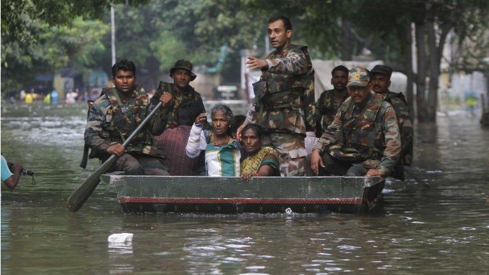 Indian army soldiers rescue flood affected people in Chennai, India, Thursday, Dec. 3, 2015.