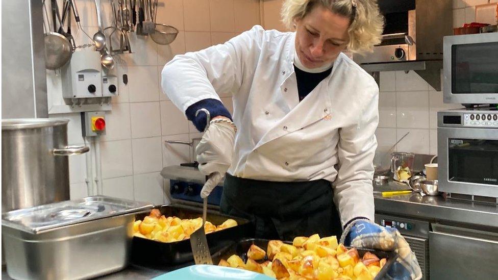 Roast potatoes being served