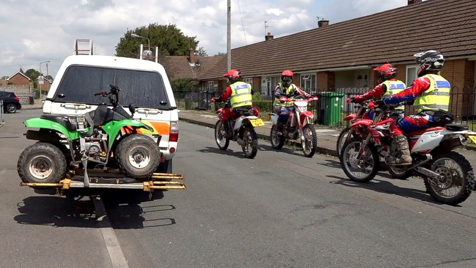 A confiscated quad bike on the back of a truck