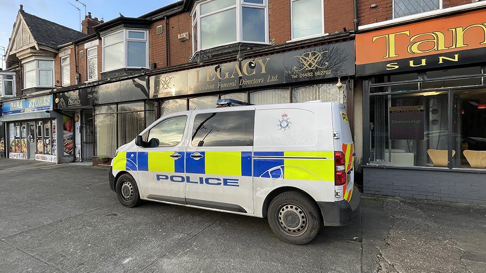 Police van outside funeral directors