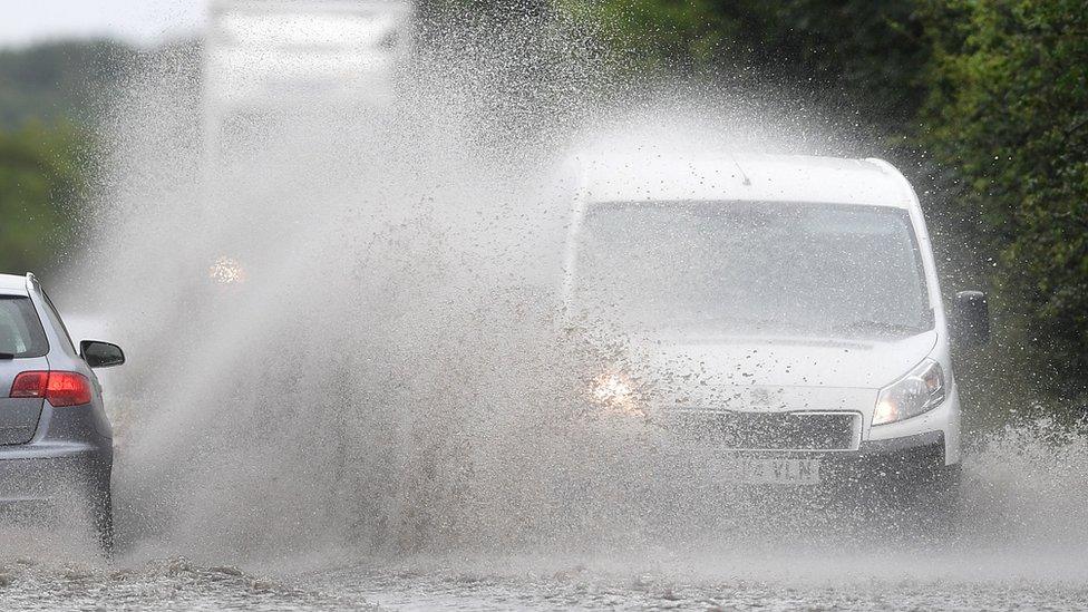 car and van drive in flooded water