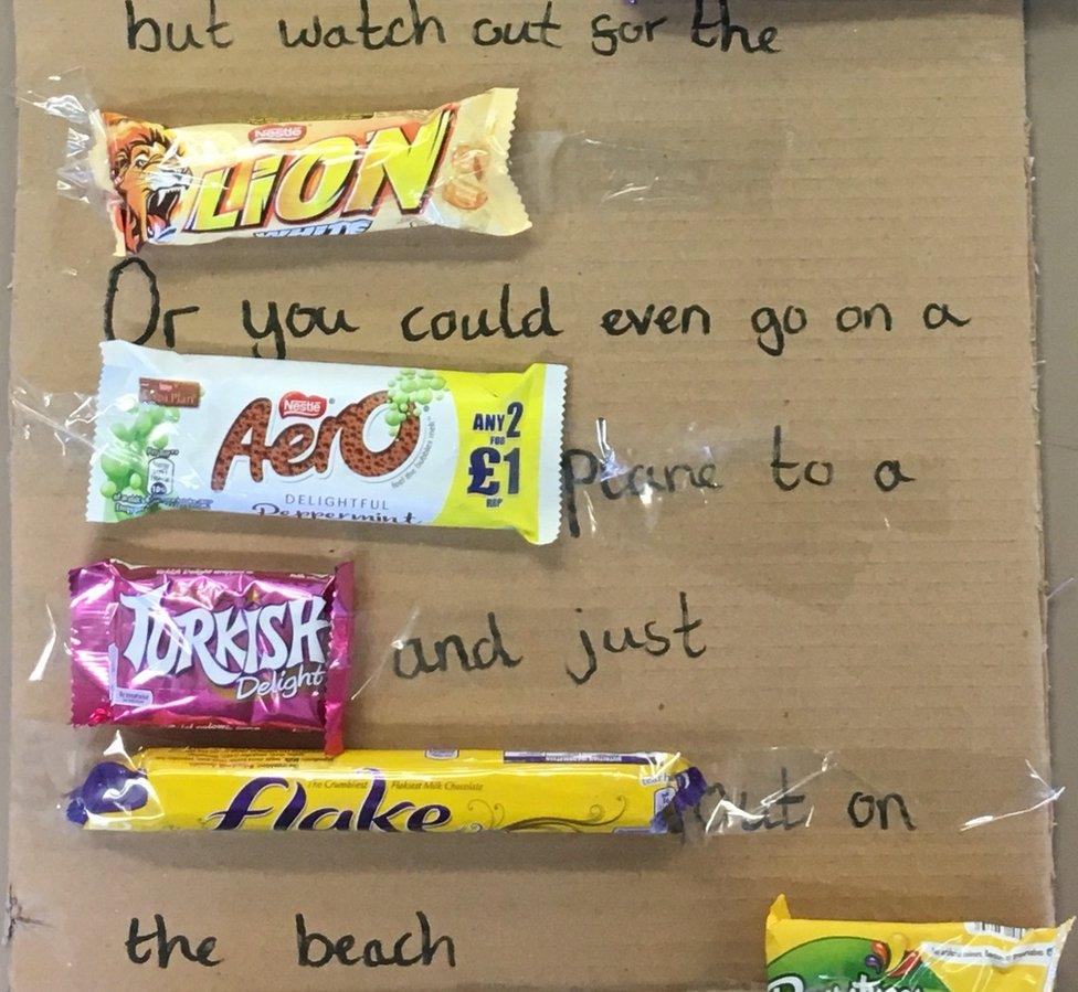 Part of the leaving gift which says: 'But watch out for the LION. Or you could even go on a AERO plane to a TURKISH DELIGHT and just FLAKE out on the beach.