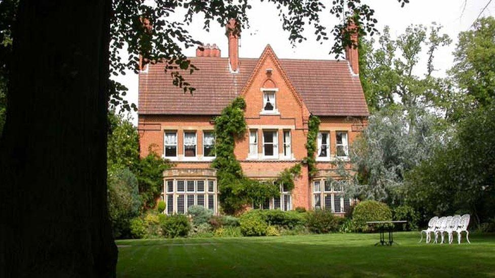 Broomhill hospital, a red brick building set in woodland