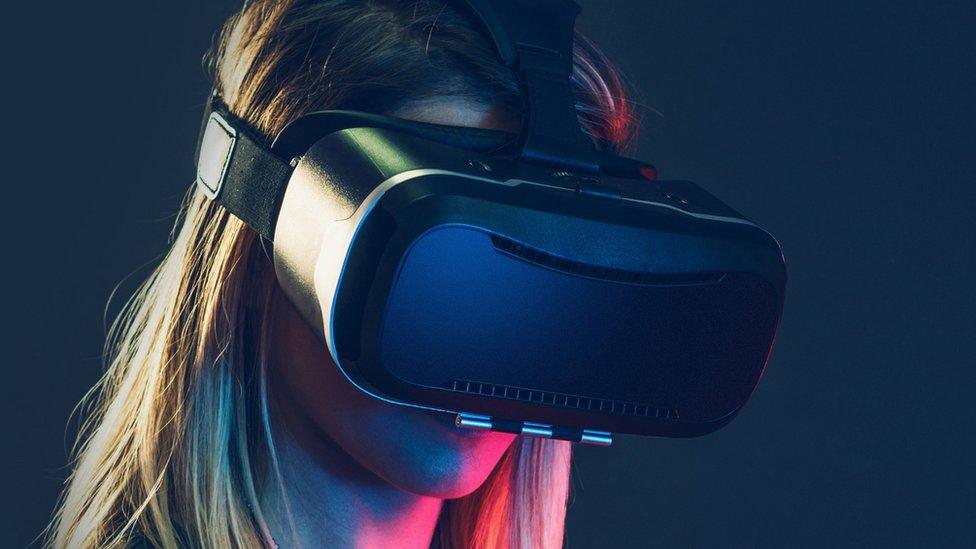 A woman in a VR headset